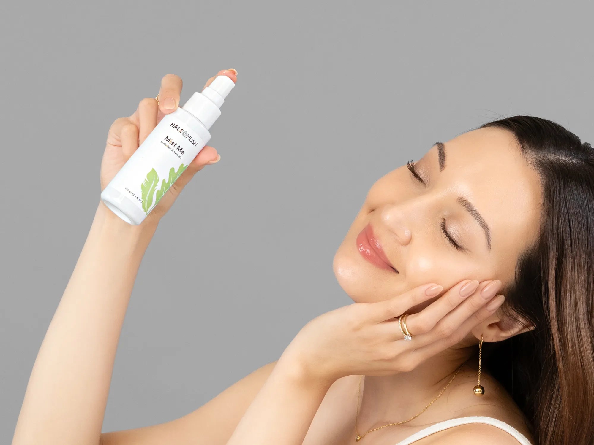 Laziza from LAZ Skincare demonstrating the texture and application of Hale & Hush Mist Me on her hand