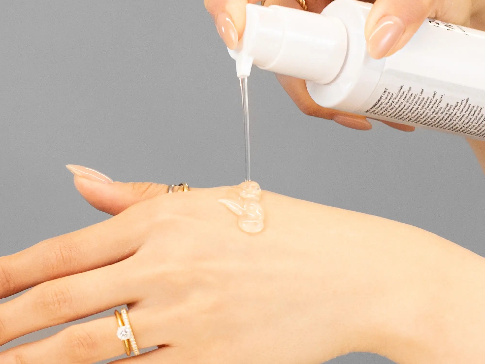 Laziza from LAZ Skincare demonstrating the texture and application of Hale & Hush Quiet Wash on her hand