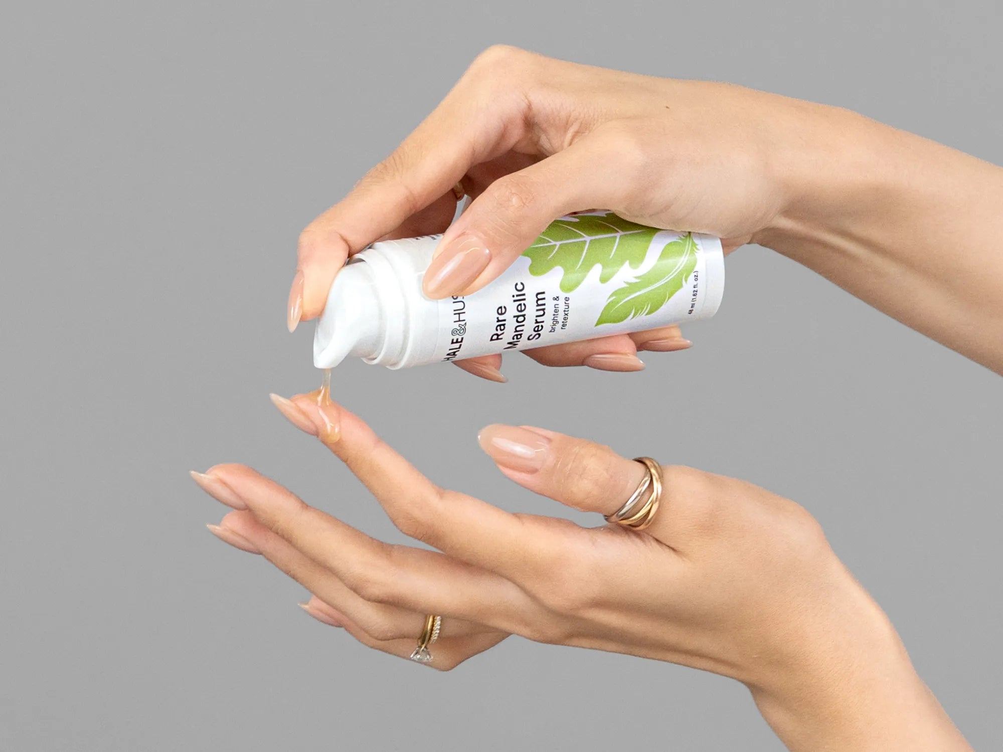 Laziza from LAZ Skincare demonstrating the texture and application of Hale & Hush Rare Mandelic Serum on her hand