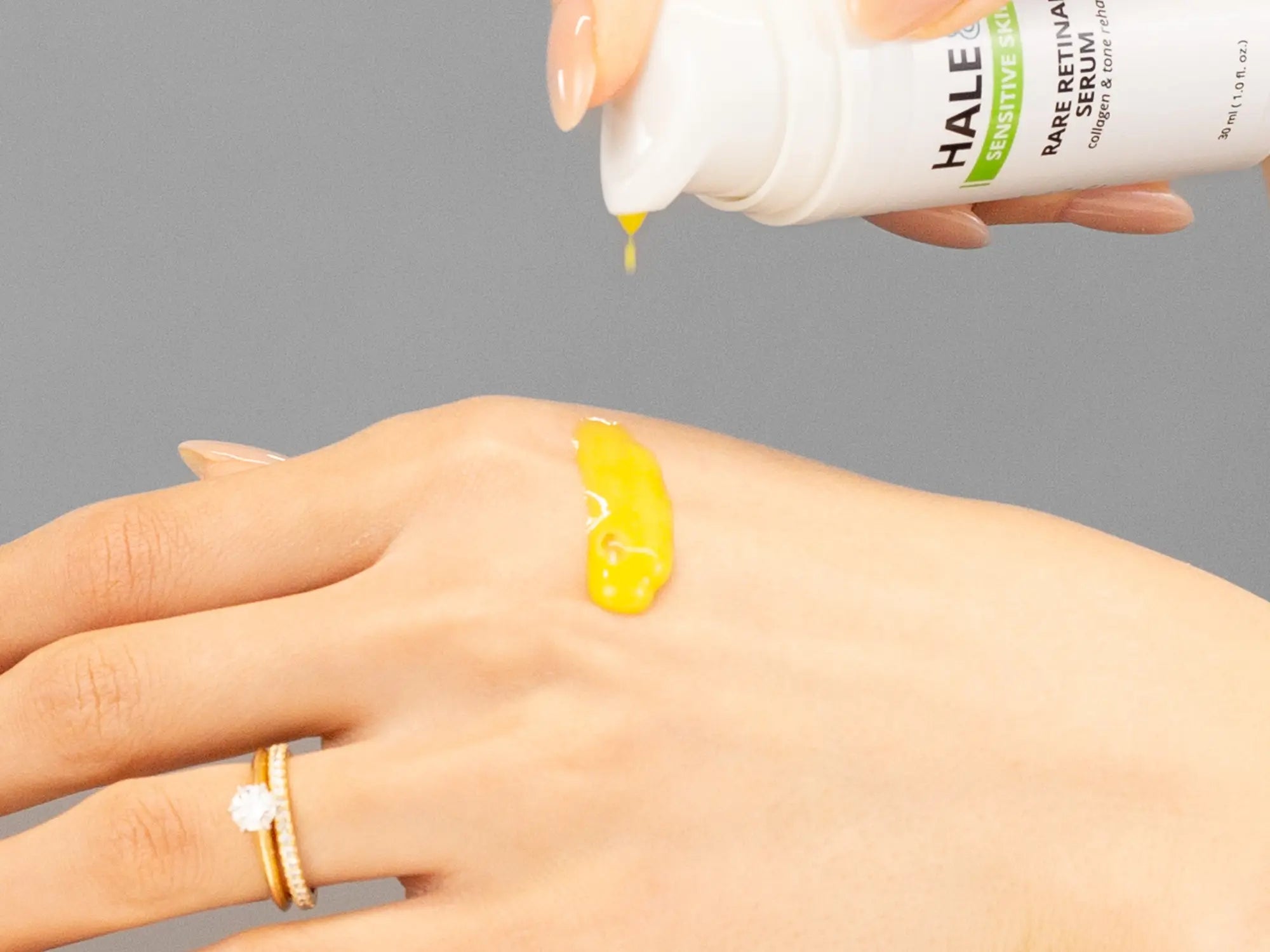 Laziza from LAZ Skincare demonstrating the texture and application of Hale & Hush Rare Mandelic Serum on her hand