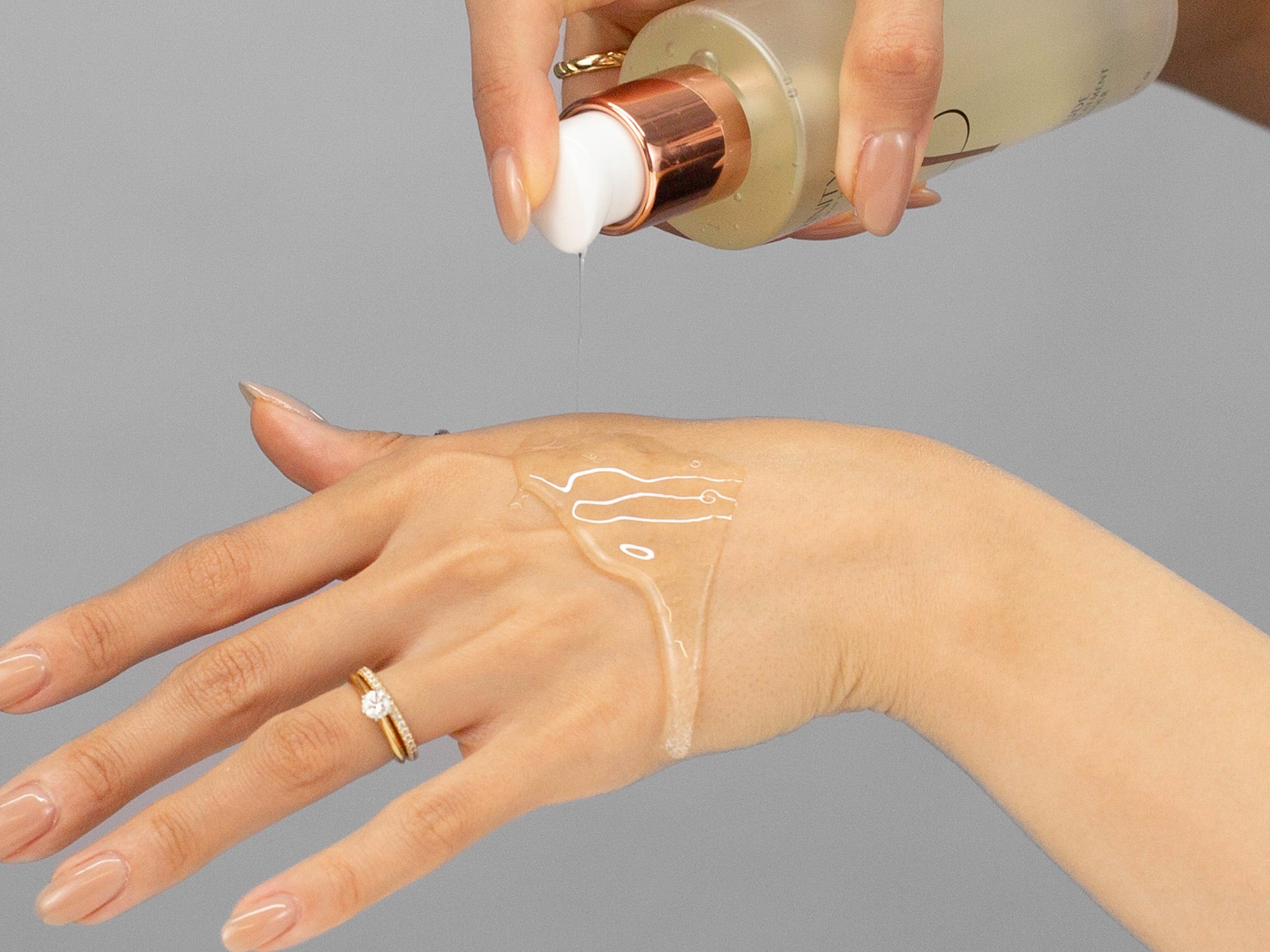 Closeup of Laziza from LAZ Skincare applying Hydrinity Prelude Facial Treatment Cleanser to her hand
