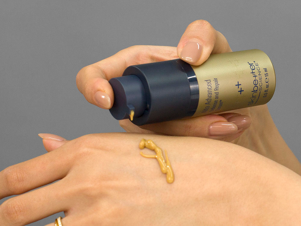Laziza from LAZ Skincare demonstrating the texture and application of SkinBetter Science Alto Advanced Defense and Repair Serum on her hand