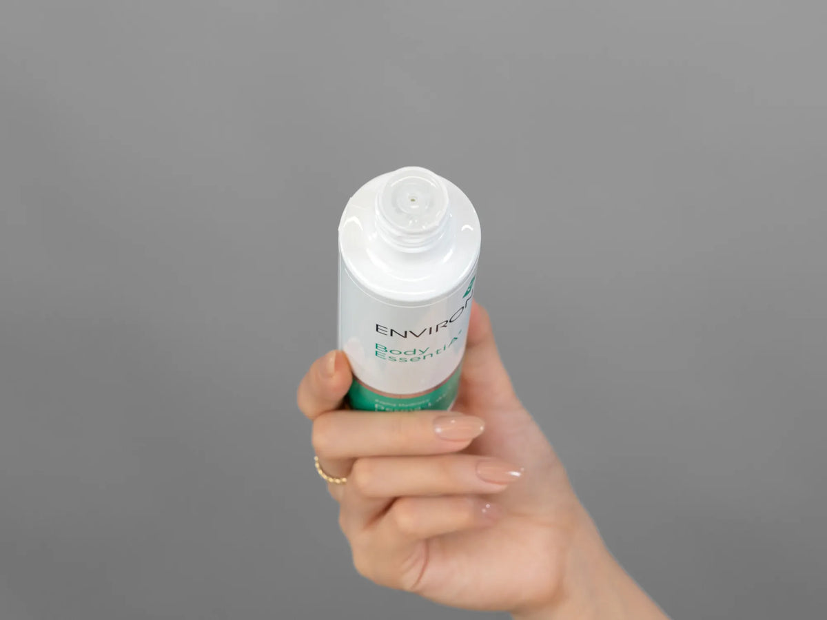Laziza from LAZ Skincare demonstrating the texture and application of Environ Derma-Lac Lotion on her hand