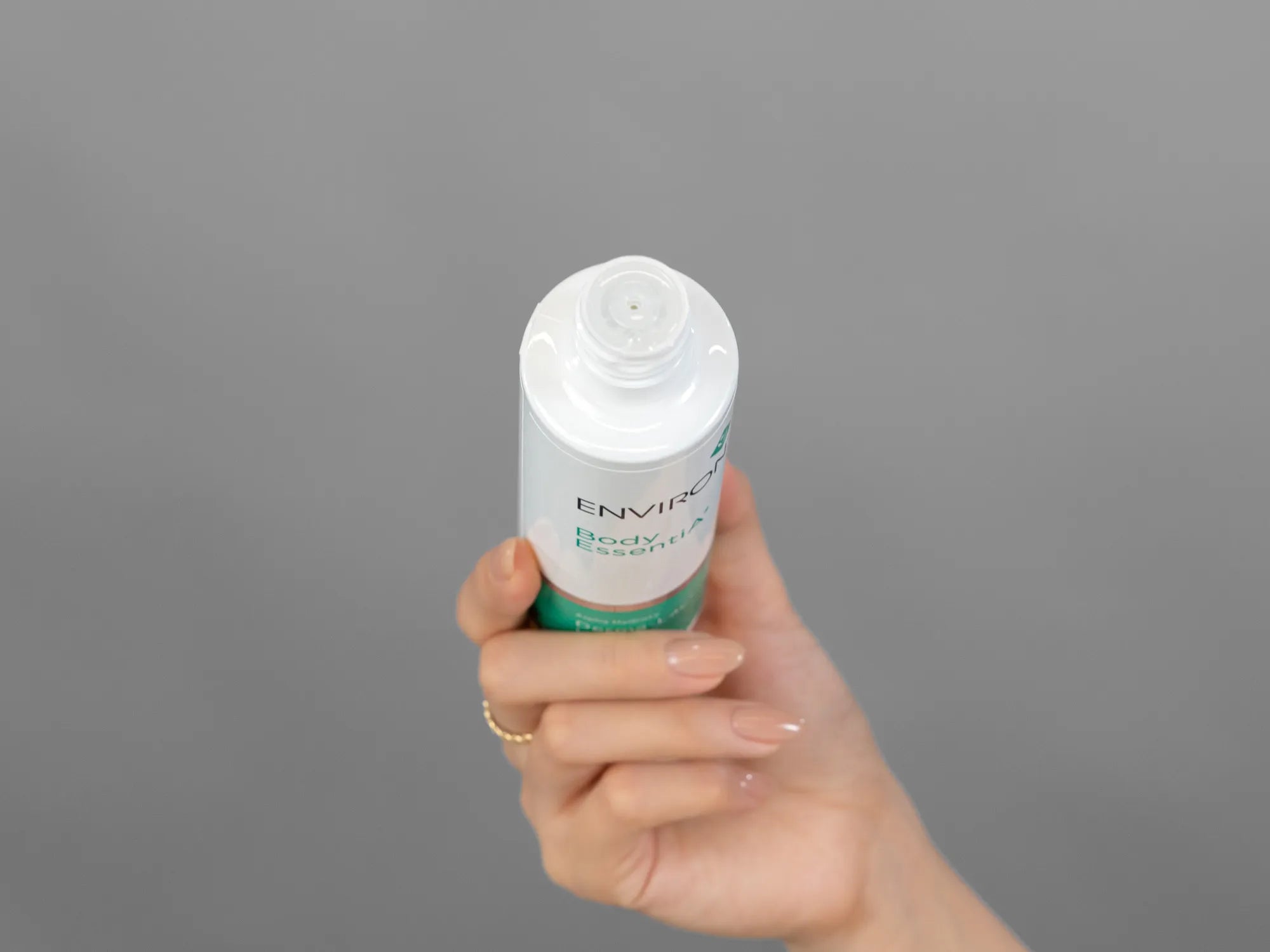 Laziza from LAZ Skincare demonstrating the texture and application of Environ Derma-Lac Lotion on her hand