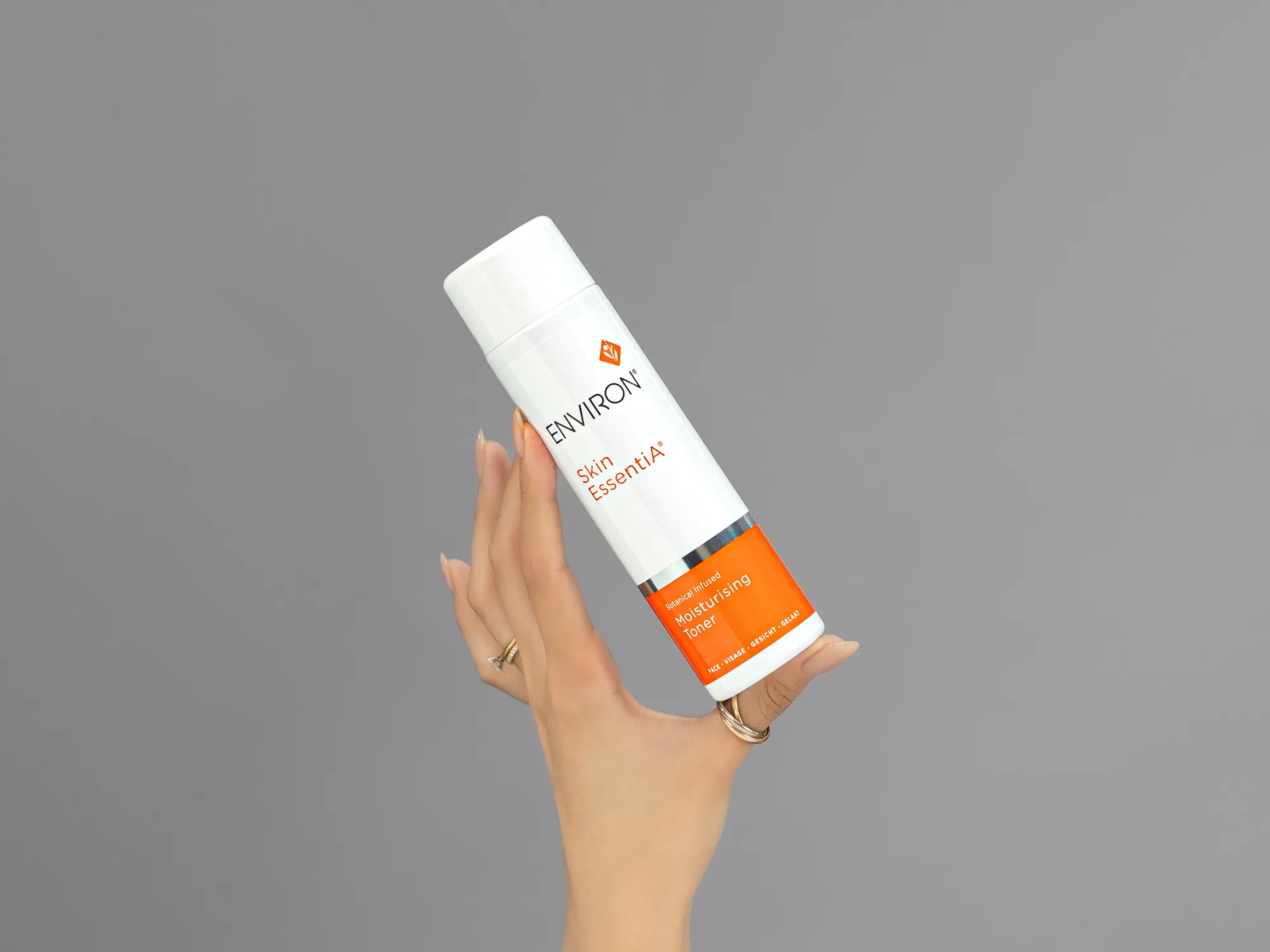 Closeup of Laziza from LAZ Skincare holding up a bottle of Environ Moisturising Toner
