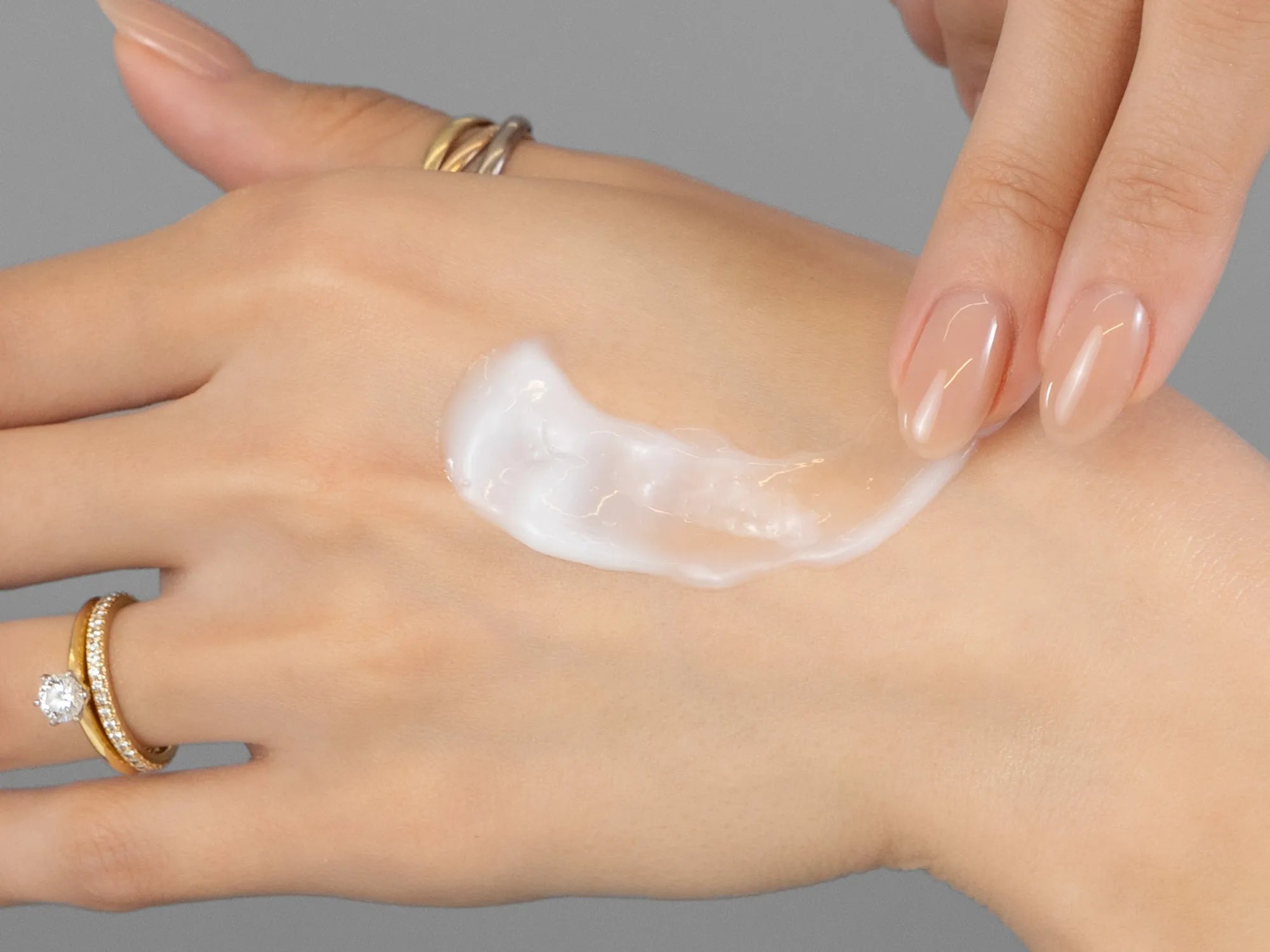 Laziza from LAZ Skincare demonstrating the texture and application of Environ Tri Bio-Botanical Revival Masque on her hand