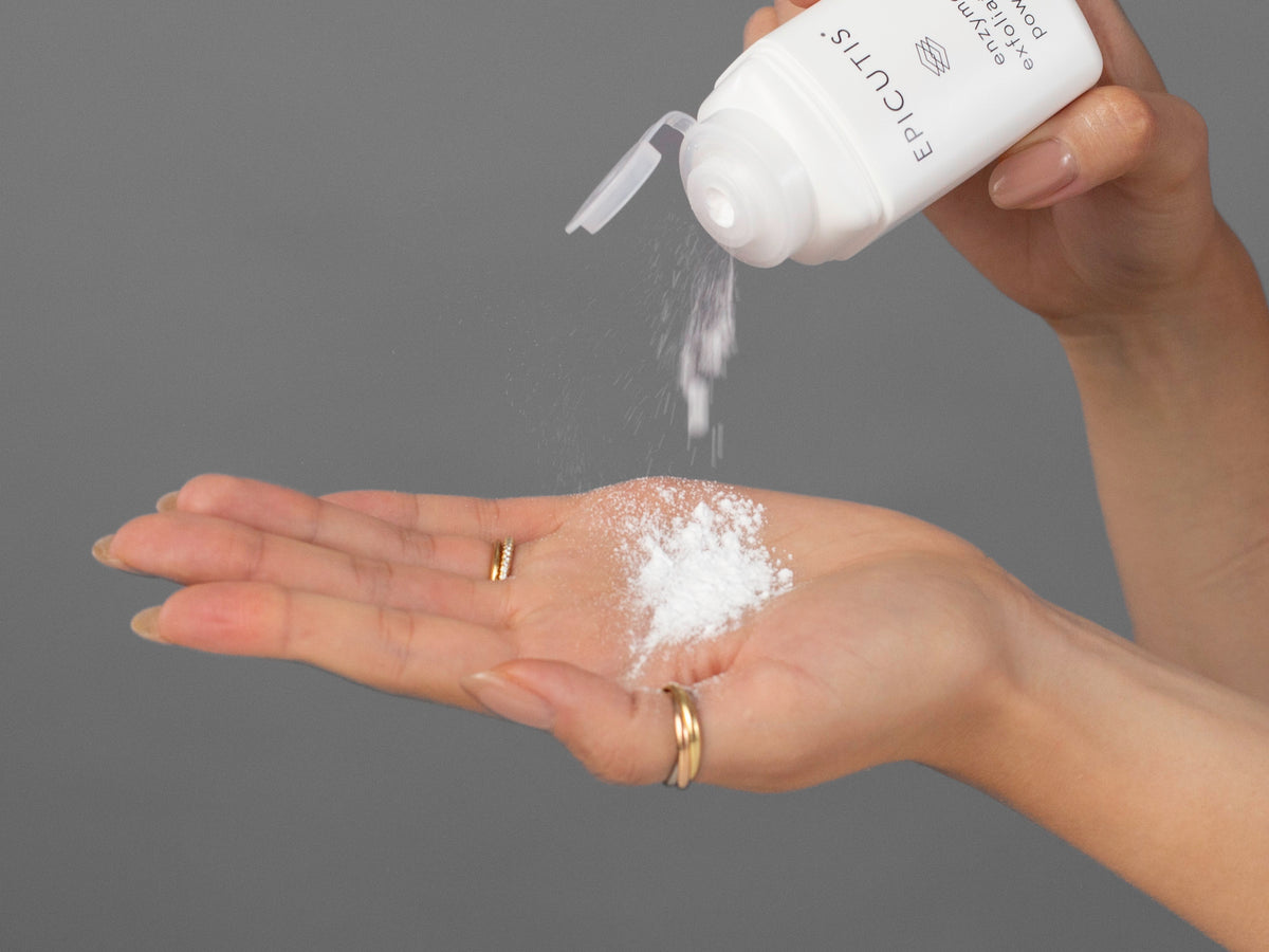 Closeup of Laziza from LAZ Skincare holding up a bottle of Epicutis Cleansing Essentials Set