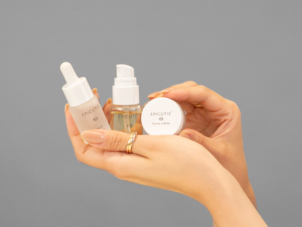 Laziza from LAZ Skincare demonstrating the texture and application of Epicutis Luxury Travel Set on her hand