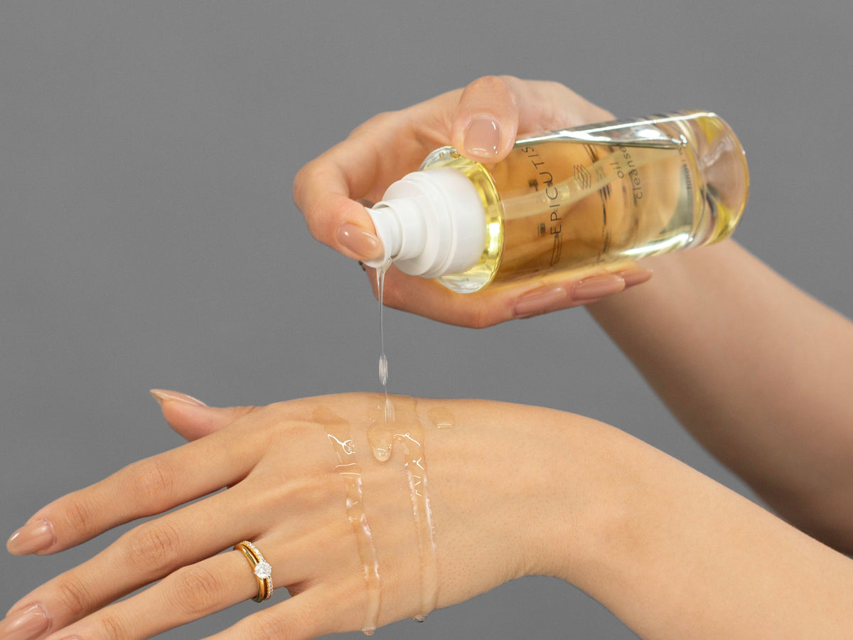 Laziza from LAZ Skincare demonstrating the texture and application of Epicutis Oil Cleanser on her hand