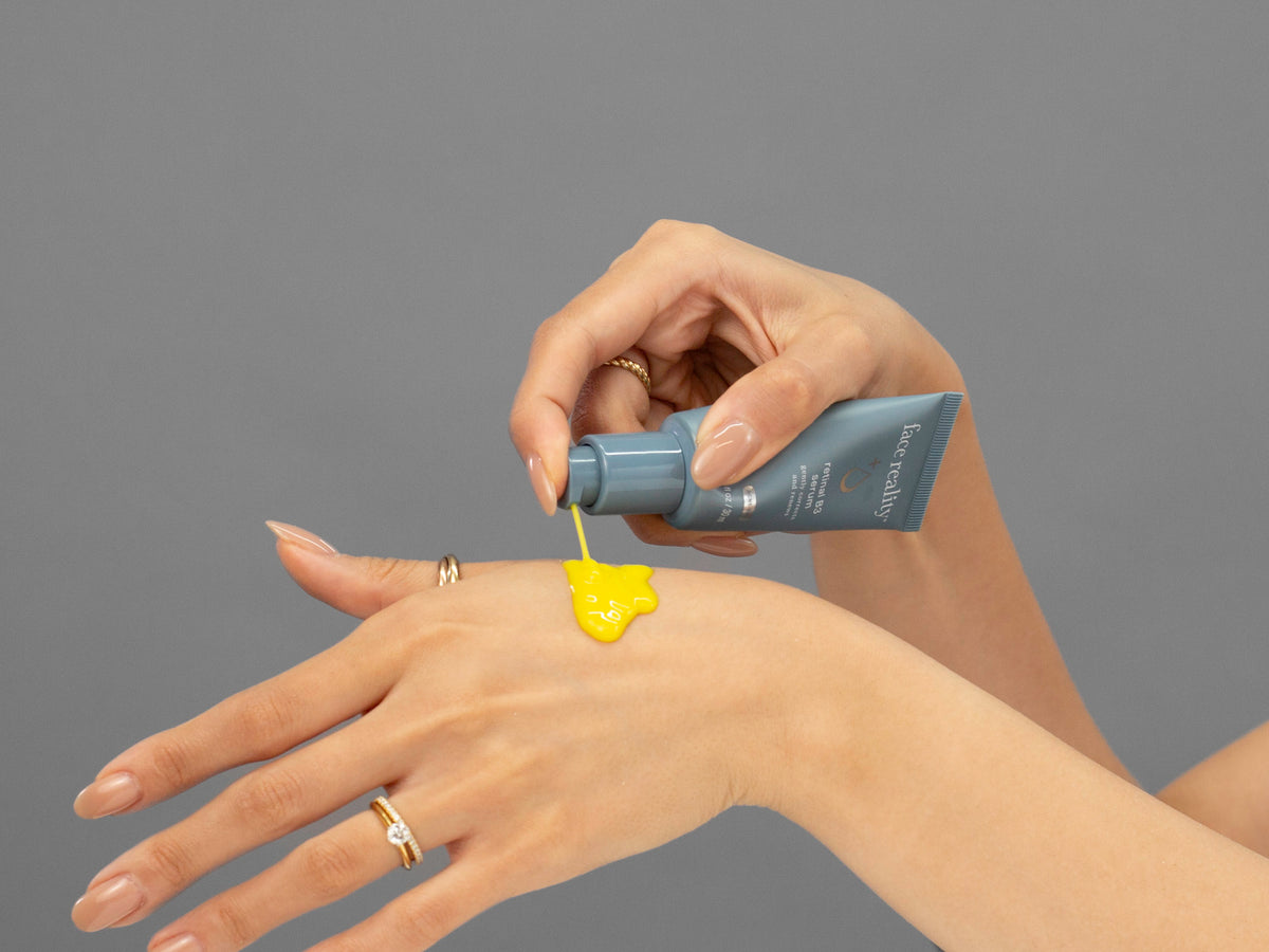 Laziza from LAZ Skincare demonstrating the texture and application of Face Reality Retinal B3 Serum on her hand