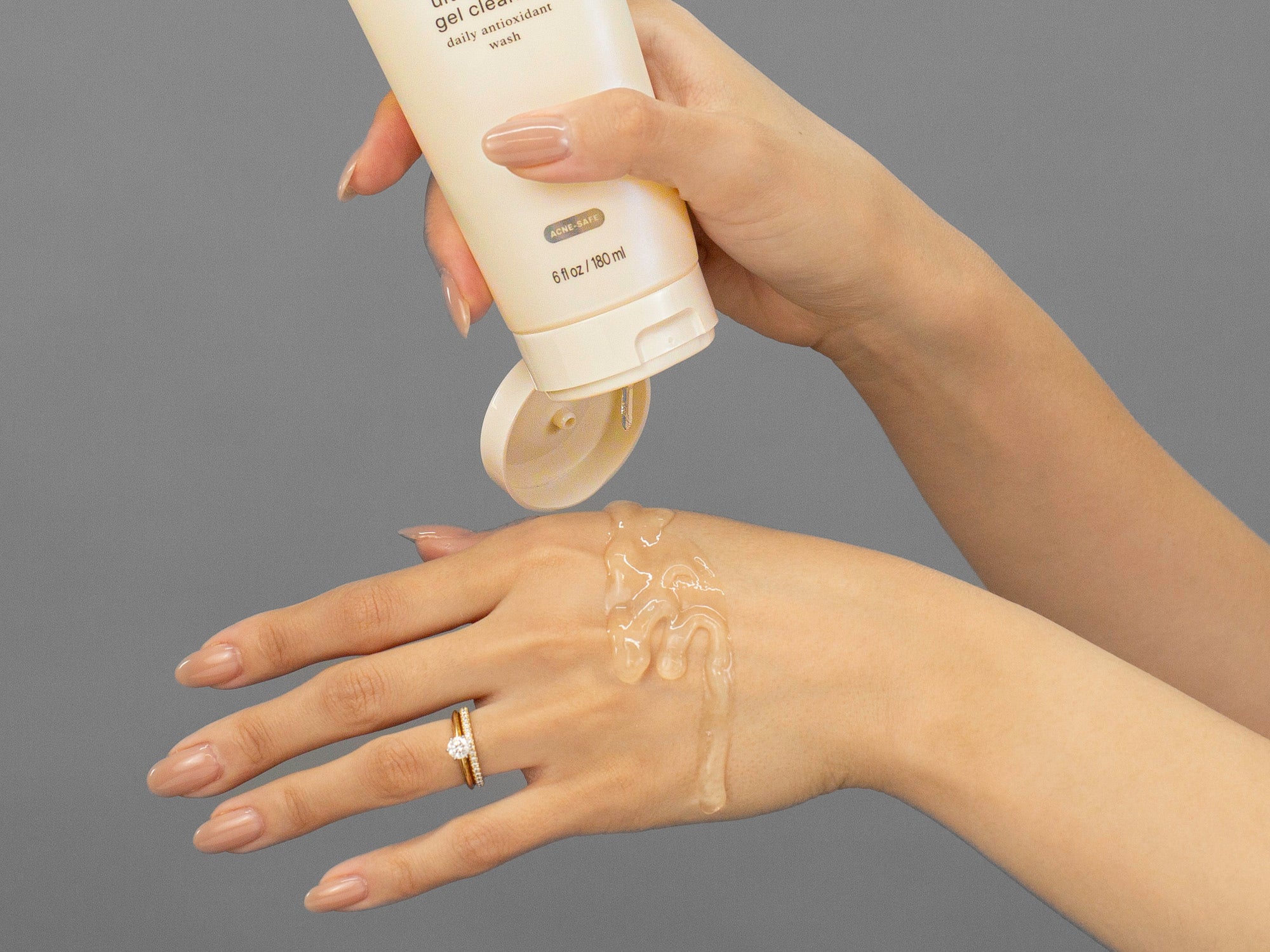 Closeup of Laziza from LAZ Skincare applying Face Reality Ultra Gentle Gel Cleanser to her hand