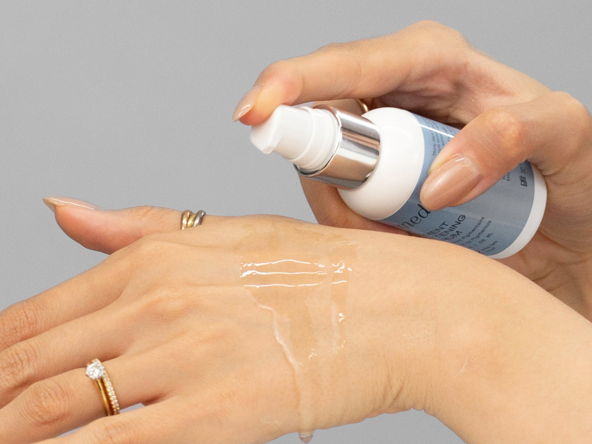 Laziza from LAZ Skincare demonstrating the texture and application of GlyMed Pigment Brightening Serum on her hand