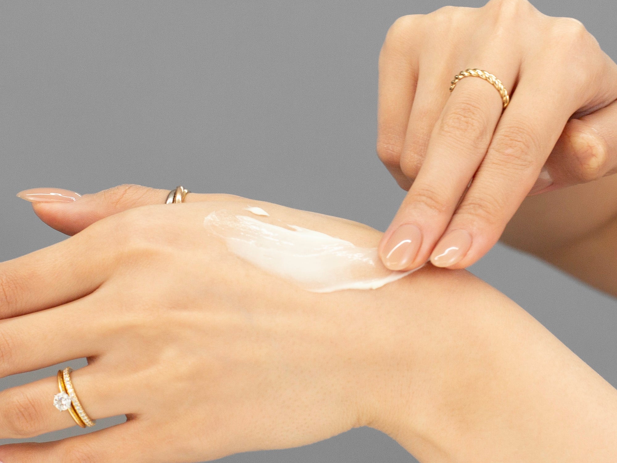 Closeup of Laziza from LAZ Skincare demonstrating the texture of GlyMed Skin Resurfacing Lotion on her skin