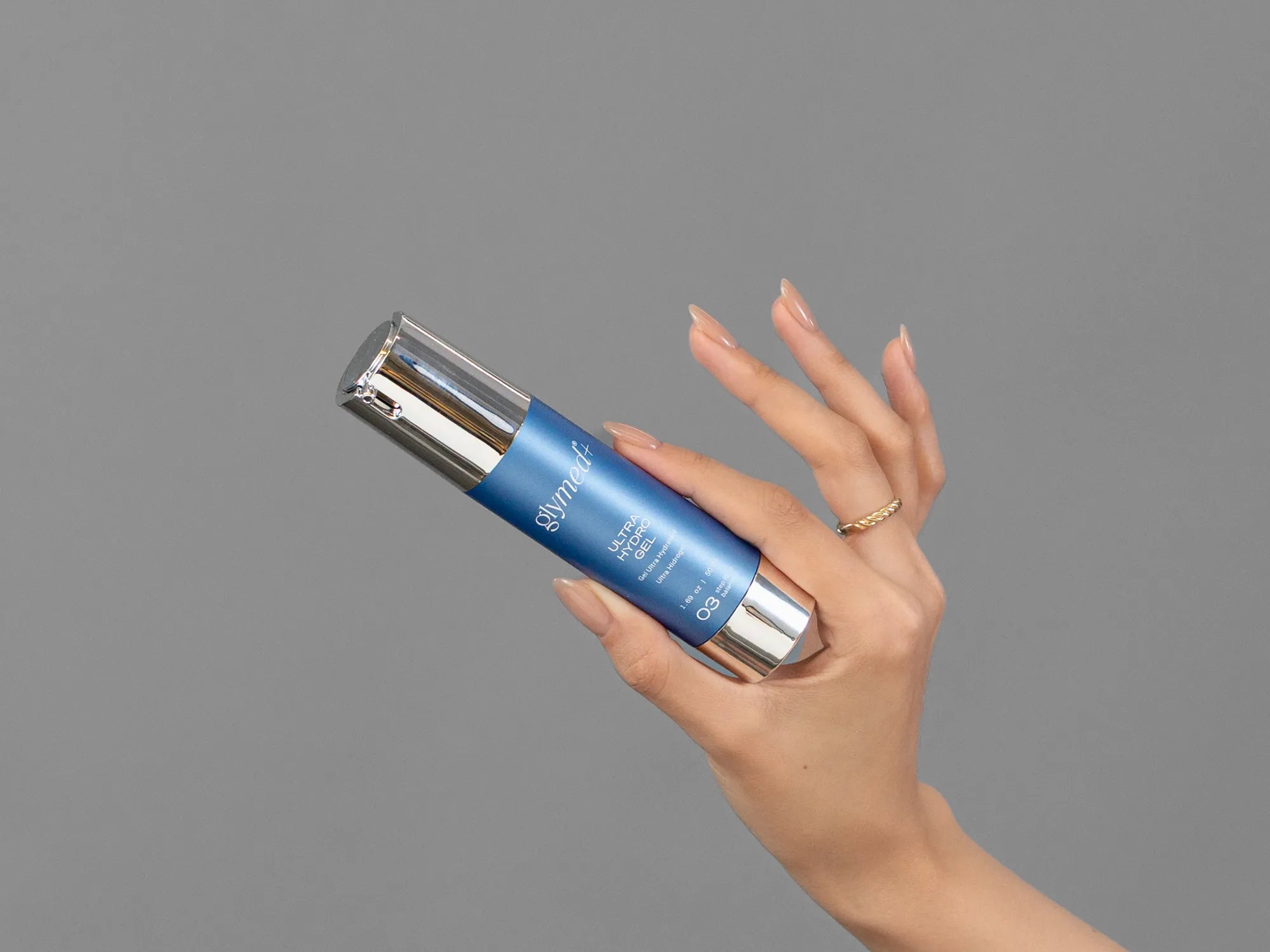 Closeup of Laziza from LAZ Skincare holding up a bottle of GlyMed Ultra Hydro Gel