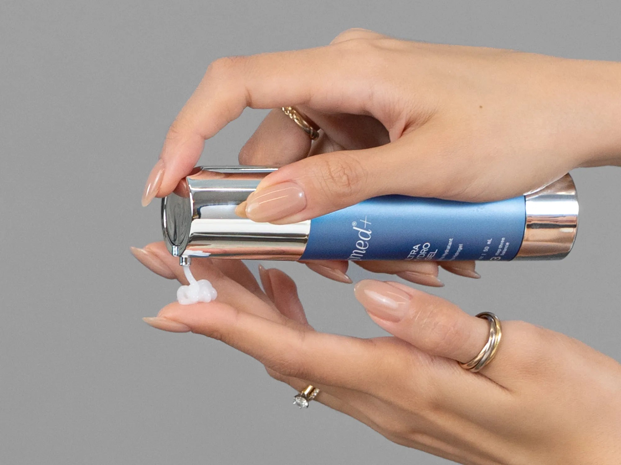 Laziza from LAZ Skincare demonstrating the texture and application of GlyMed Ultra Hydro Gel on her hand