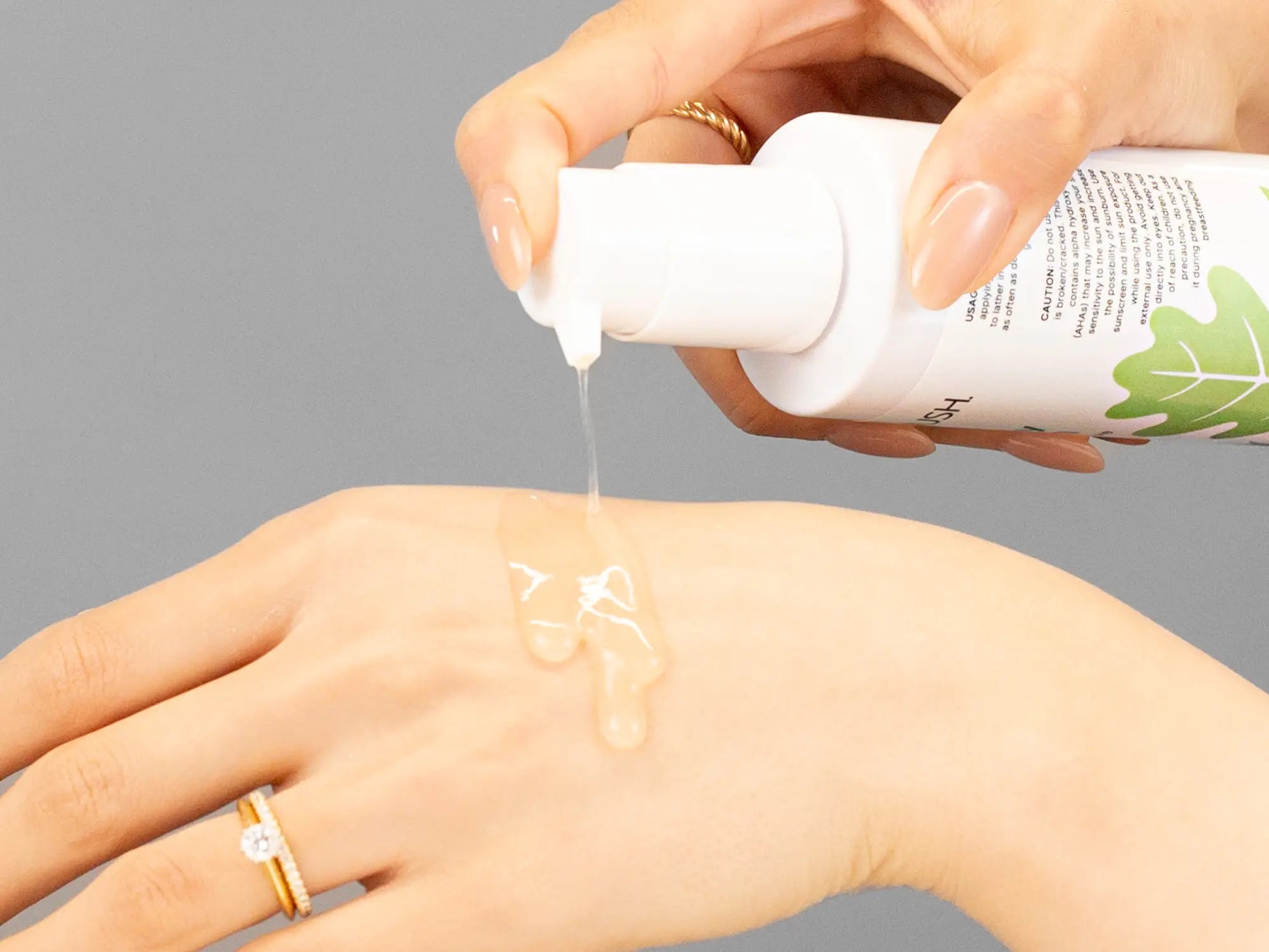 Laziza from LAZ Skincare demonstrating the texture and application of Hale & Hush Clarify Wash on her hand