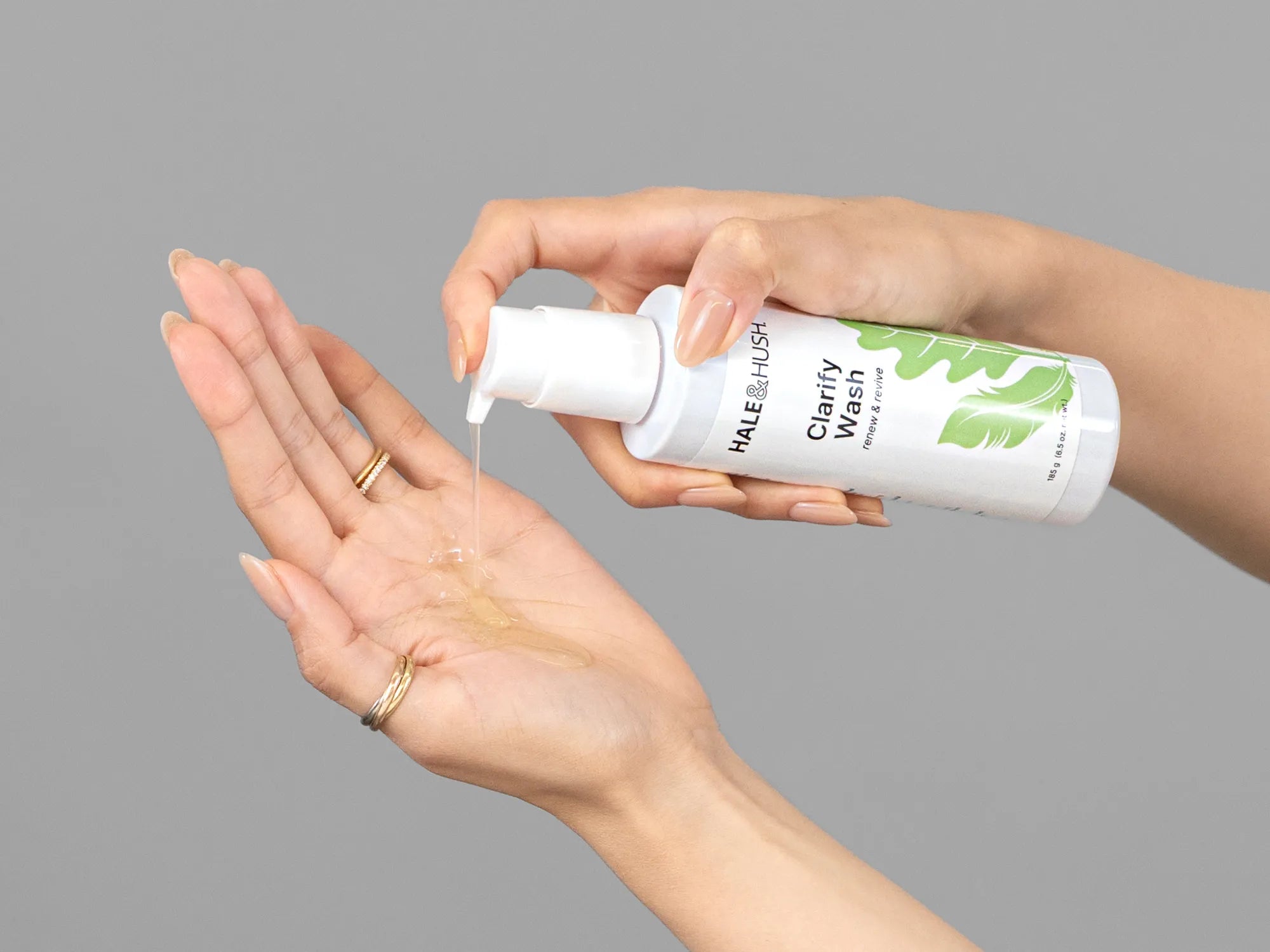 Laziza from LAZ Skincare demonstrating the texture and application of Hale & Hush Clarify Wash on her hand