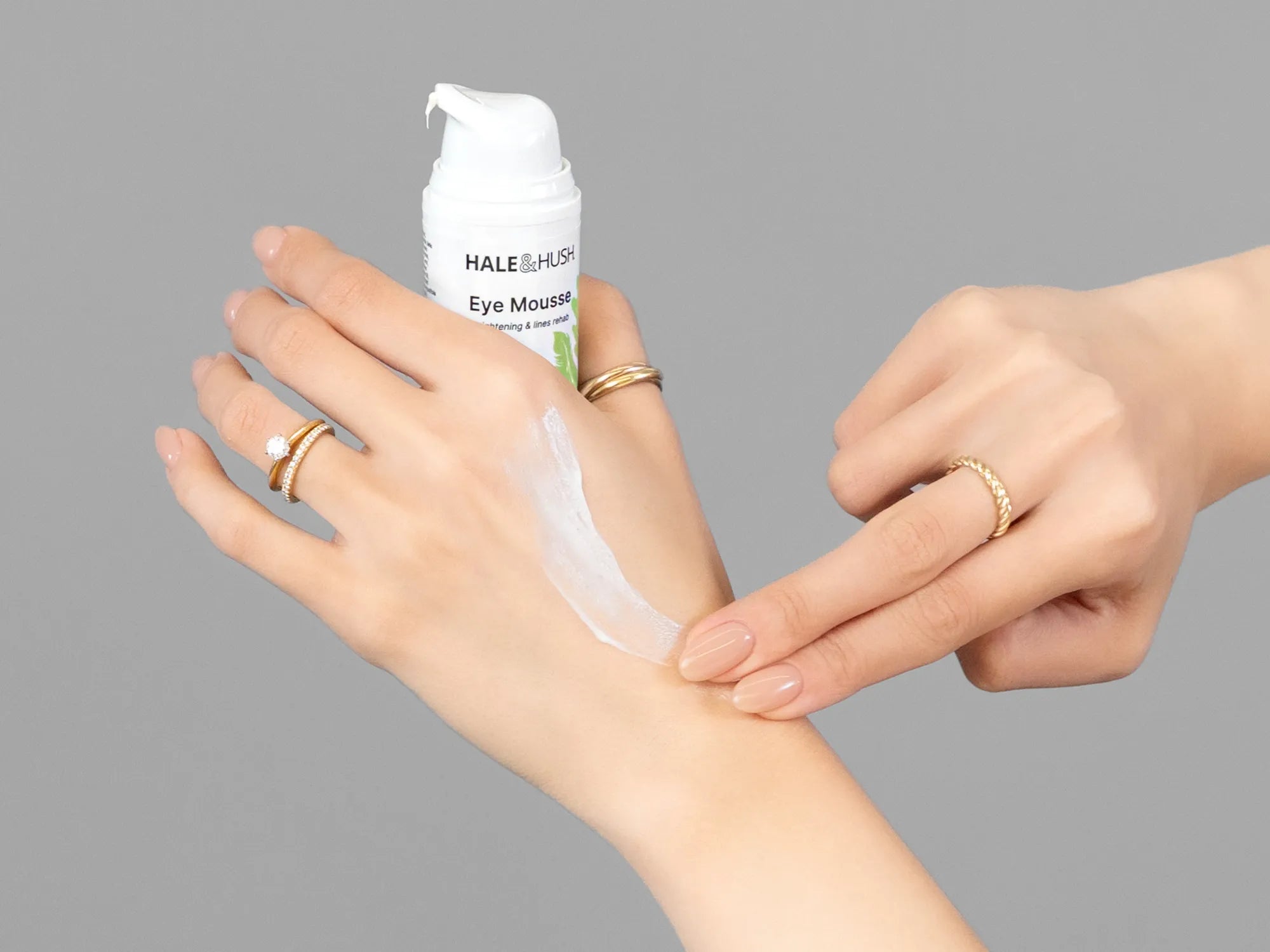 Laziza from LAZ Skincare demonstrating the texture and application of Hale & Hush Eye Mousse on her hand