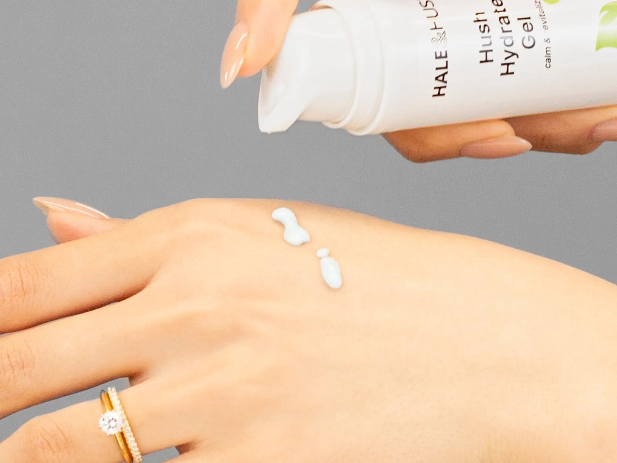 Laziza from LAZ Skincare demonstrating the texture and application of Hale & Hush Hush Hydrate Gel on her hand