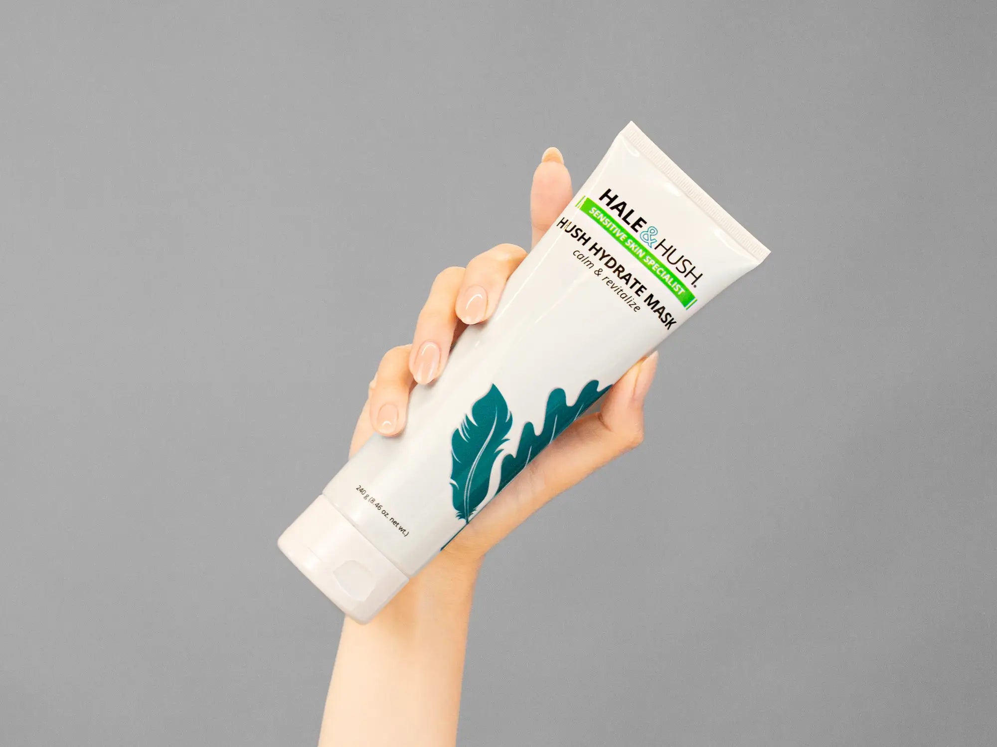 Closeup of Laziza from LAZ Skincare holding up a bottle of Hale & Hush Hush Hydrate Mask