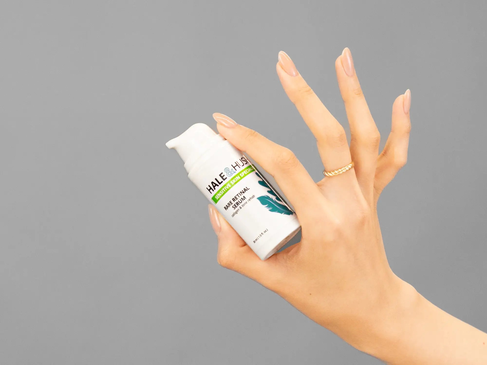 Closeup of Laziza from LAZ Skincare holding up a bottle of Hale & Hush Rare Mandelic Serum