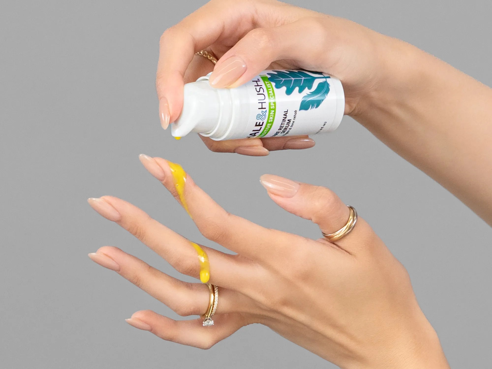 Laziza from LAZ Skincare demonstrating the texture and application of Hale & Hush Rare Retinal Serum on her hand
