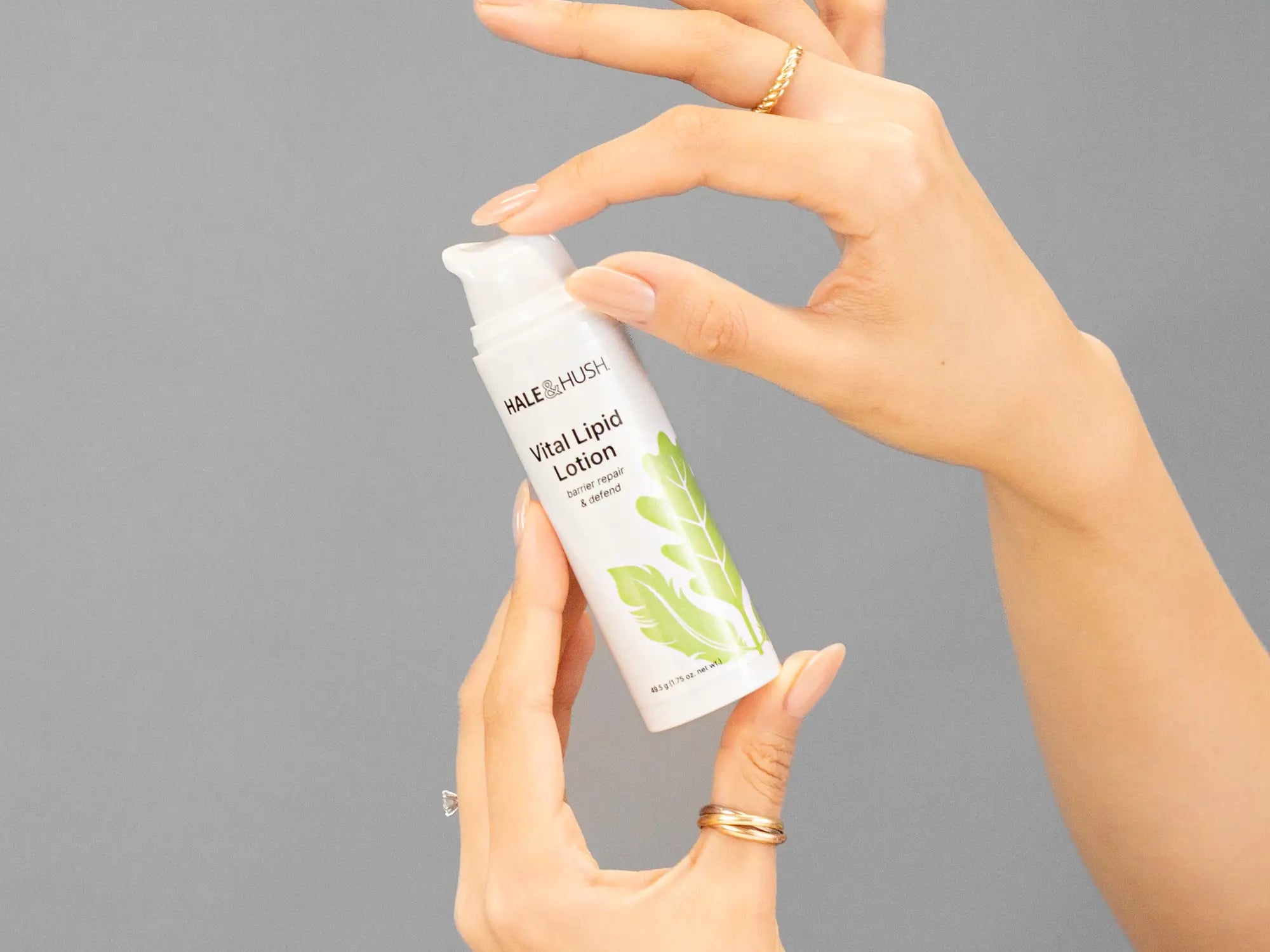 Laziza from LAZ Skincare demonstrating the texture and application of Hale & Hush Vital Lipid Lotion on her hand