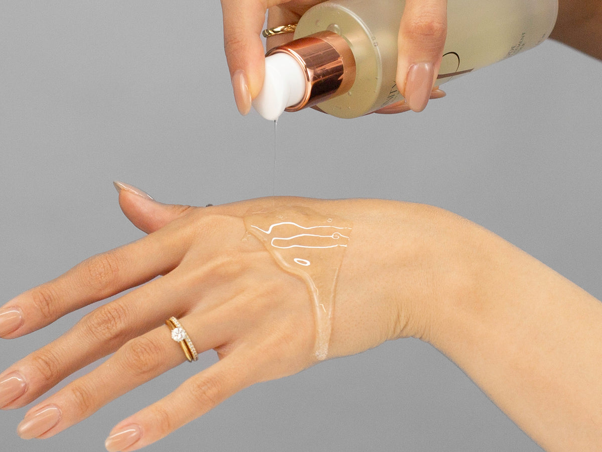 Laziza from LAZ Skincare demonstrating the texture and application of Hydrinity Prelude Facial Treatment Cleanser on her hand