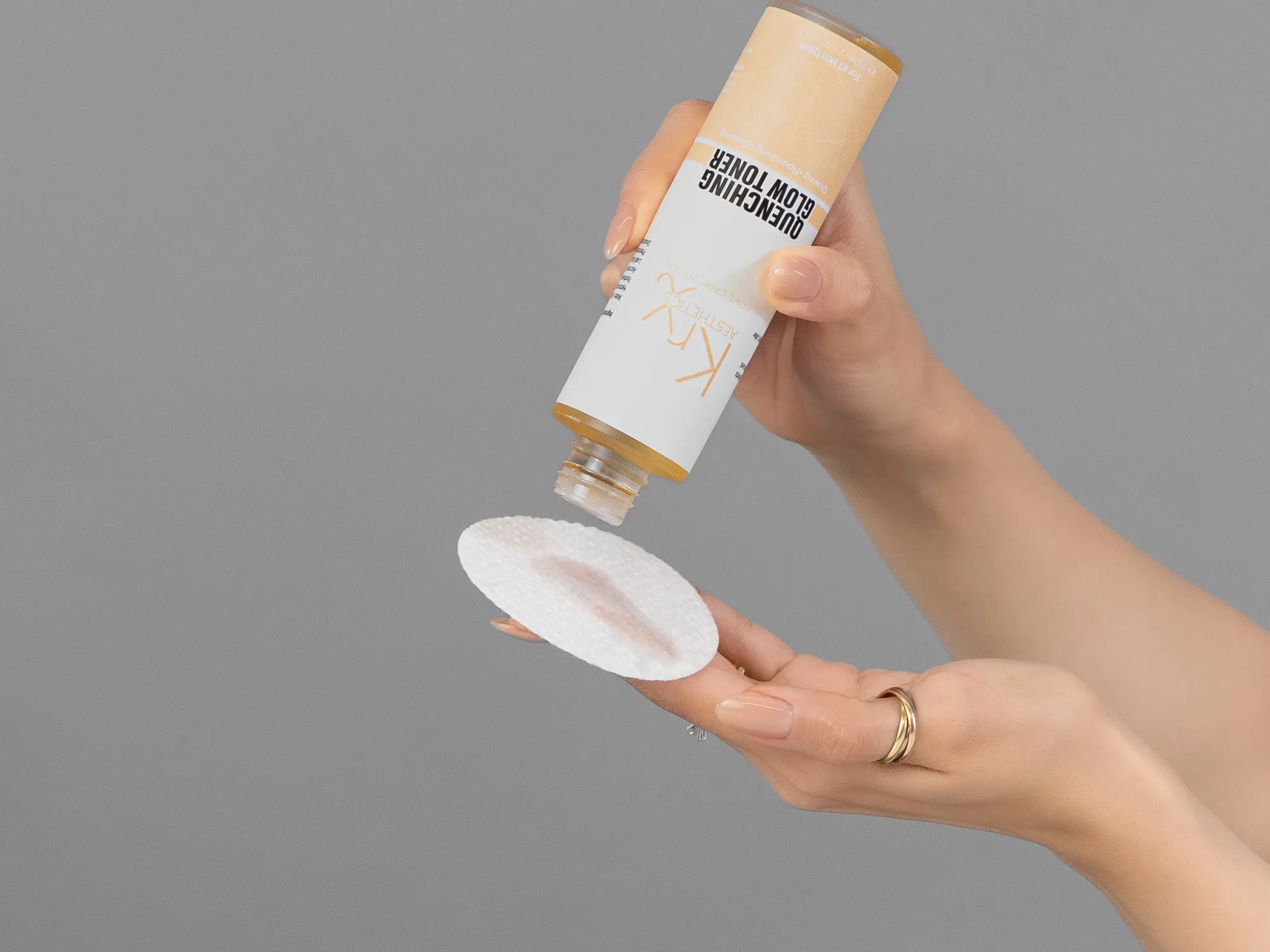 Laziza from LAZ Skincare demonstrating the texture and application of KrX Aesthetics Quenching Glow Toner on her hand