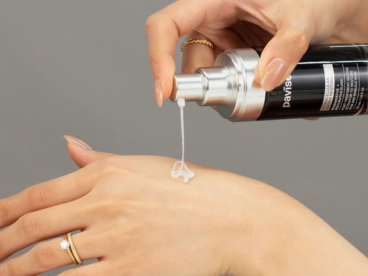 Laziza from LAZ Skincare demonstrating the texture and application of Pavise Extracellular Matrix Restore on her hand