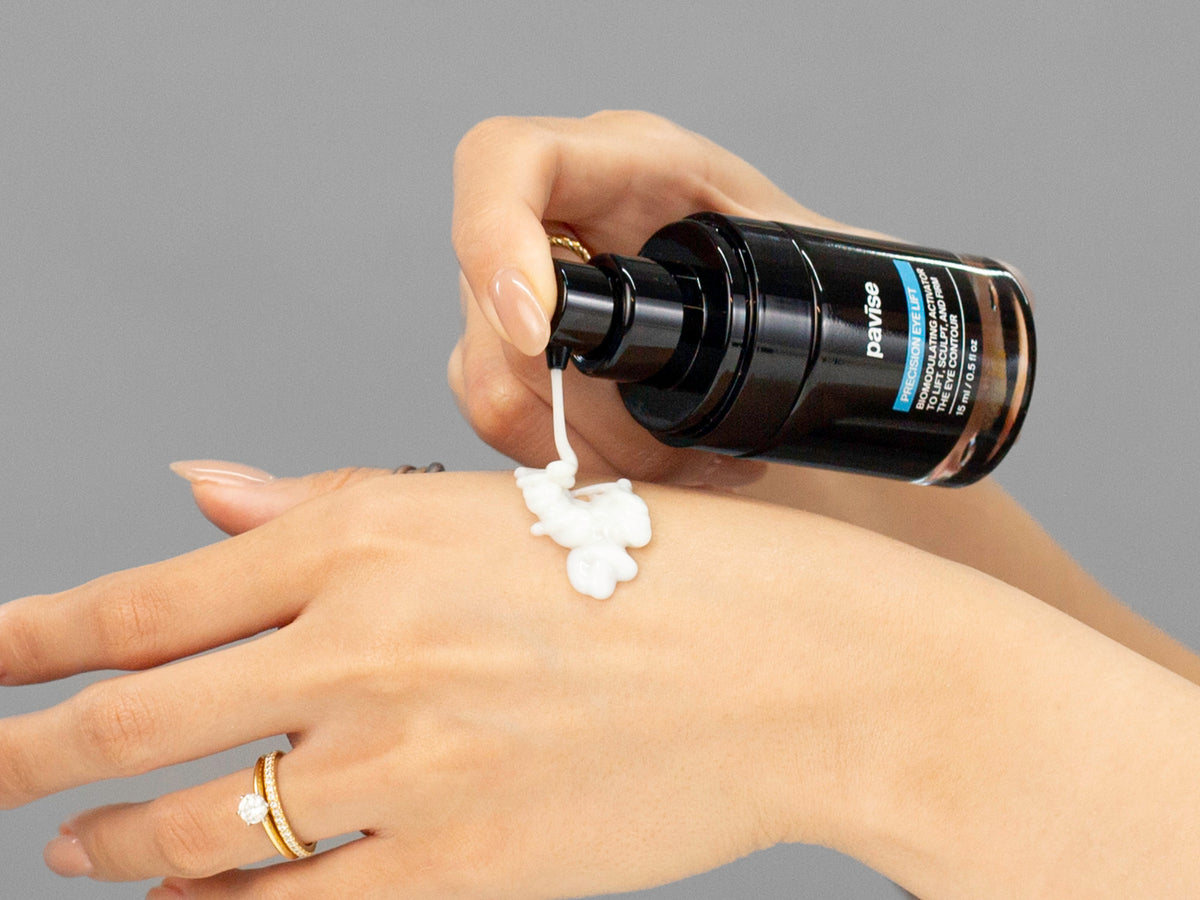 Laziza from LAZ Skincare demonstrating the texture and application of Pavise Precision Eye Lift on her hand