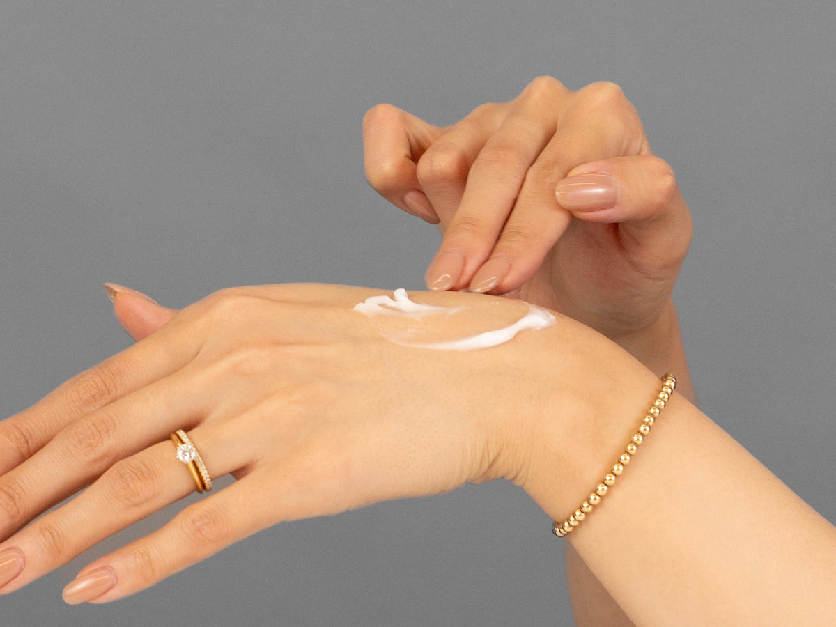 Laziza from LAZ Skincare demonstrating the texture and application of Vivant Allantoin on her hand