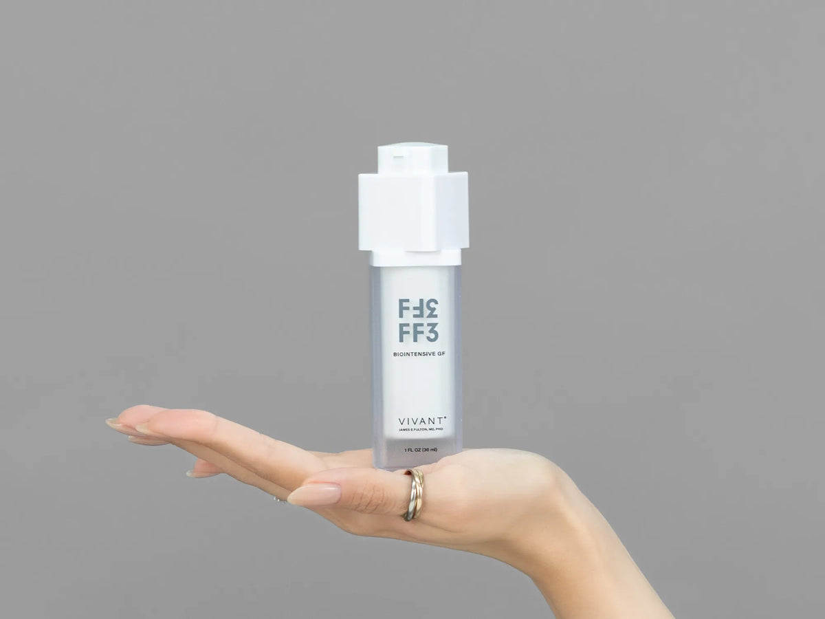Closeup of Laziza from LAZ Skincare holding up a bottle of Vivant FF3 Biointensive GF