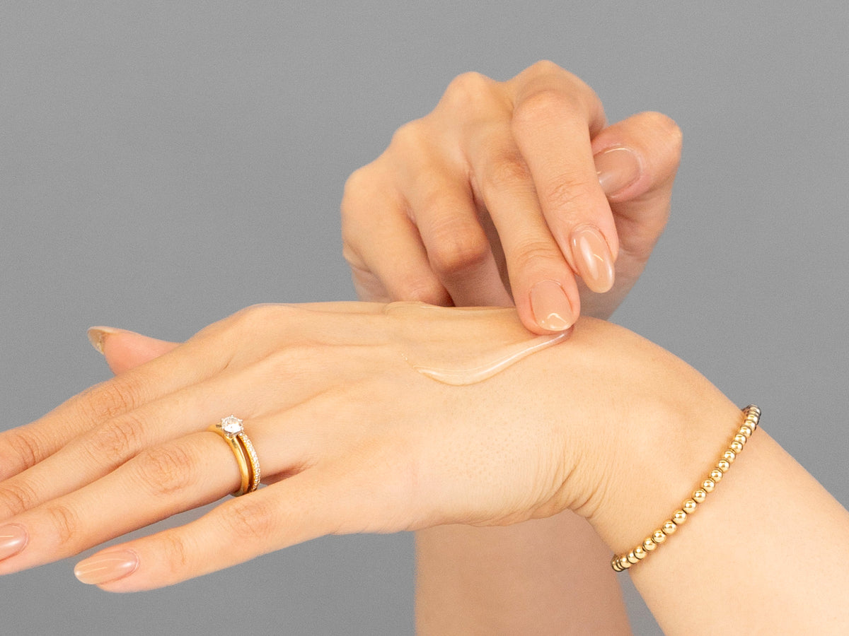 Laziza from LAZ Skincare demonstrating the texture and application of Vivant Mandelic Acid 3-in-1 Wash on her hand