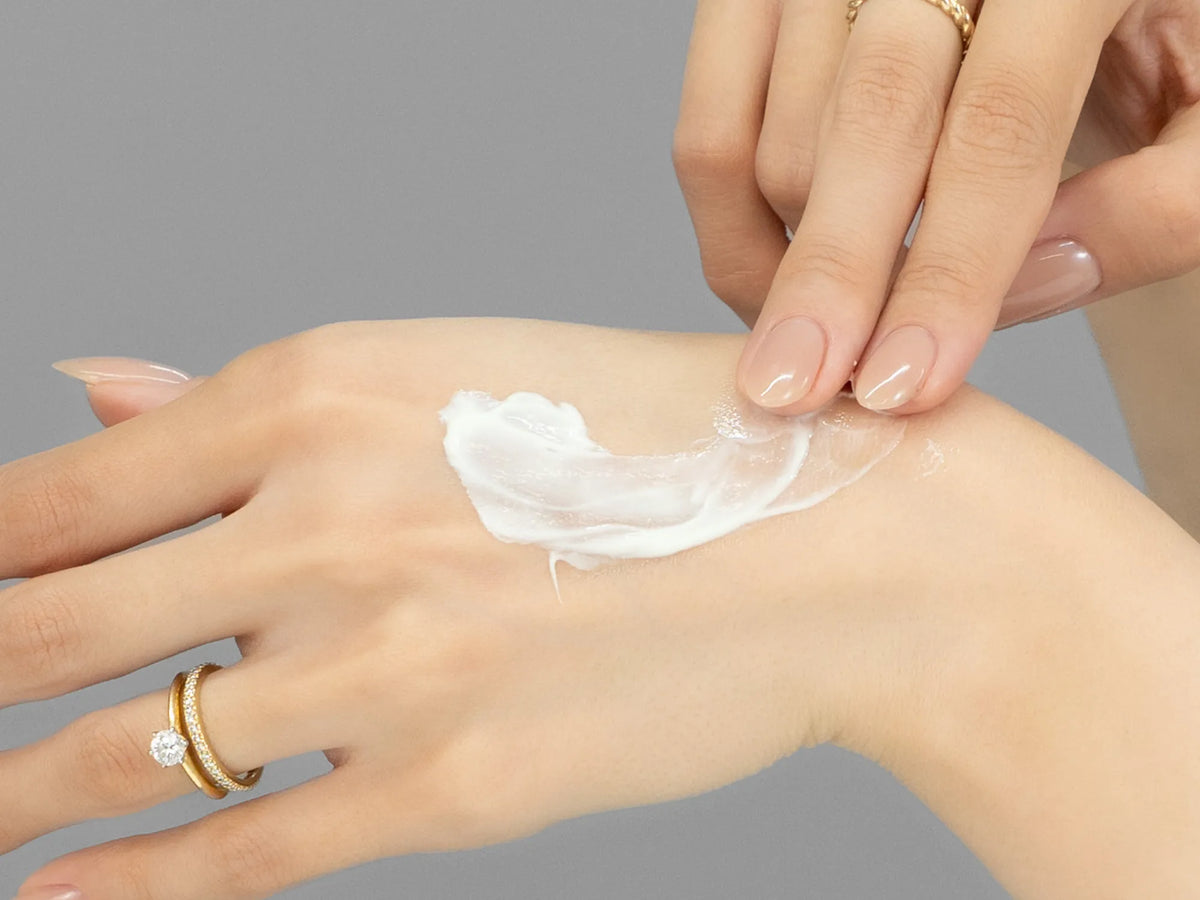 Laziza from LAZ Skincare demonstrating the texture and application of Vivant FF3 Triple Repair Complex on her hand