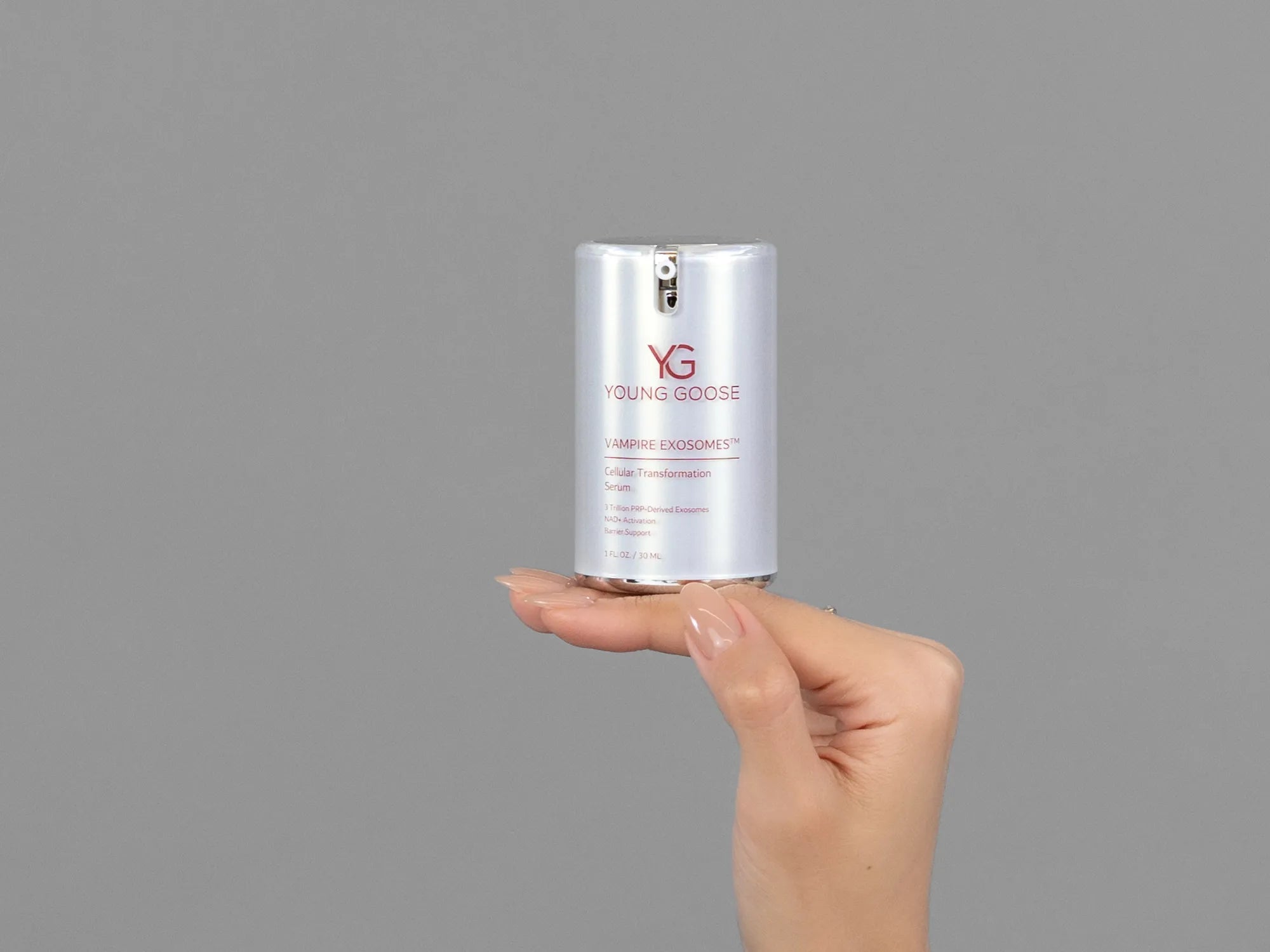 Closeup of Laziza from LAZ Skincare holding up a bottle of Young Goose Vampire Exosomes