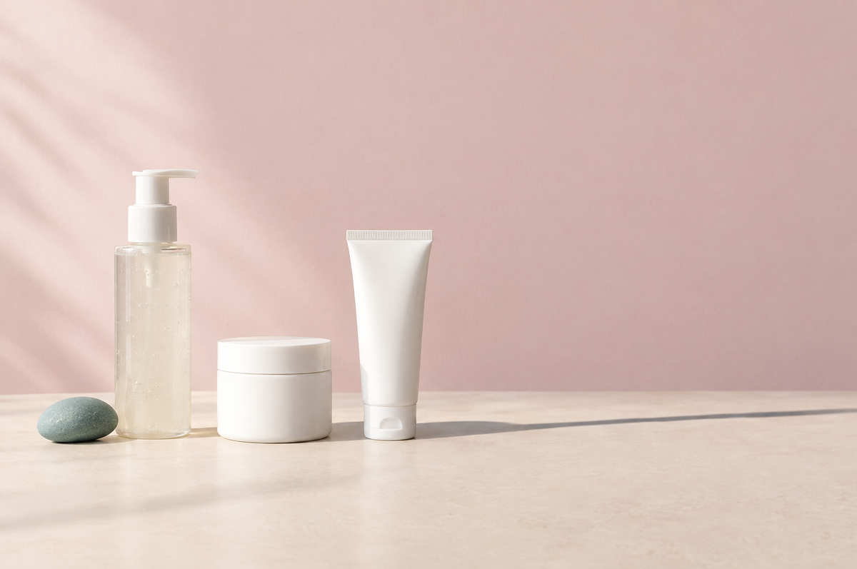 Three skincare products in a row: a cleanser, a moisturizer and a sunscreen